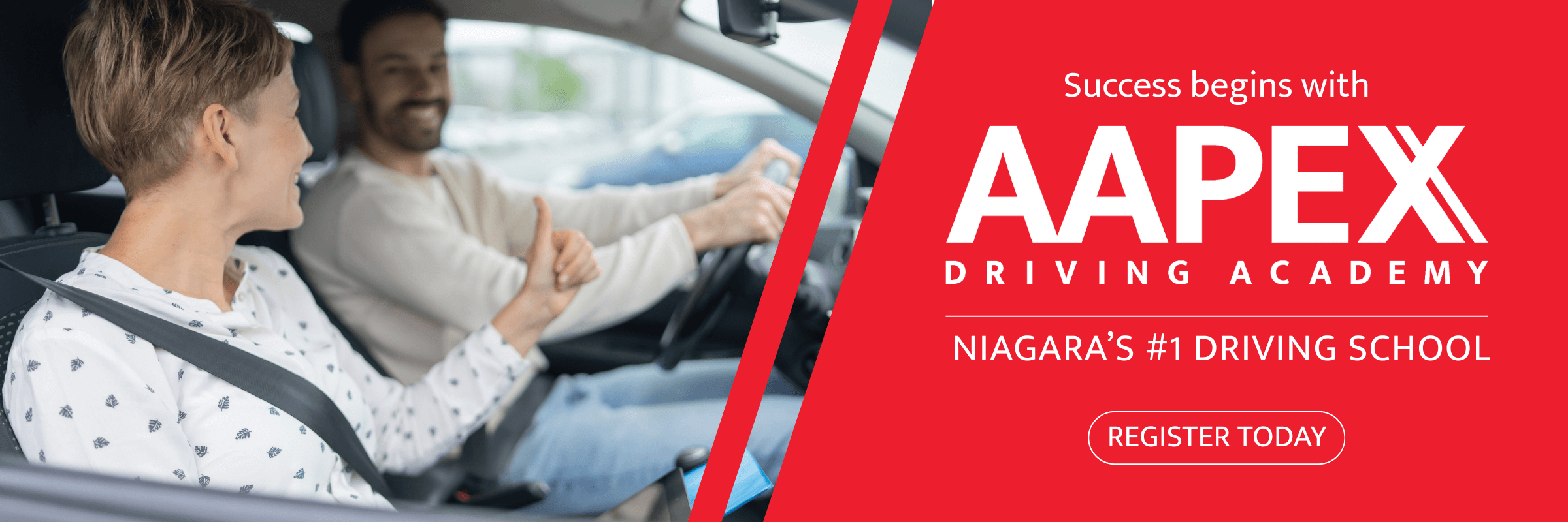 Male driver hodling the wheel, woman -passenger showing tumbs up